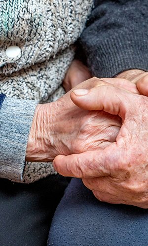 grandfather and grandmother joined hands; the manifestation of love, affection and care in old age_