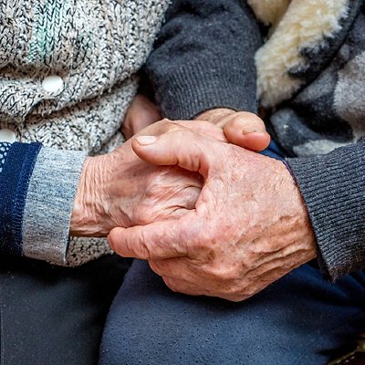 grandfather and grandmother joined hands; the manifestation of love, affection and care in old age_