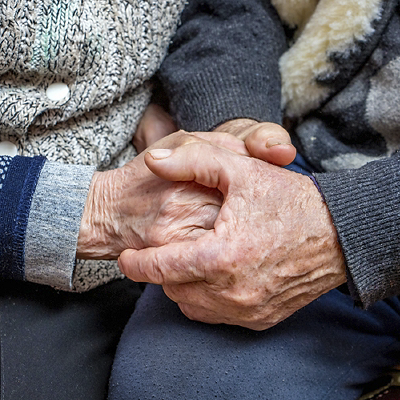 grandfather and grandmother joined hands; the manifestation of love, affection and care in old age_